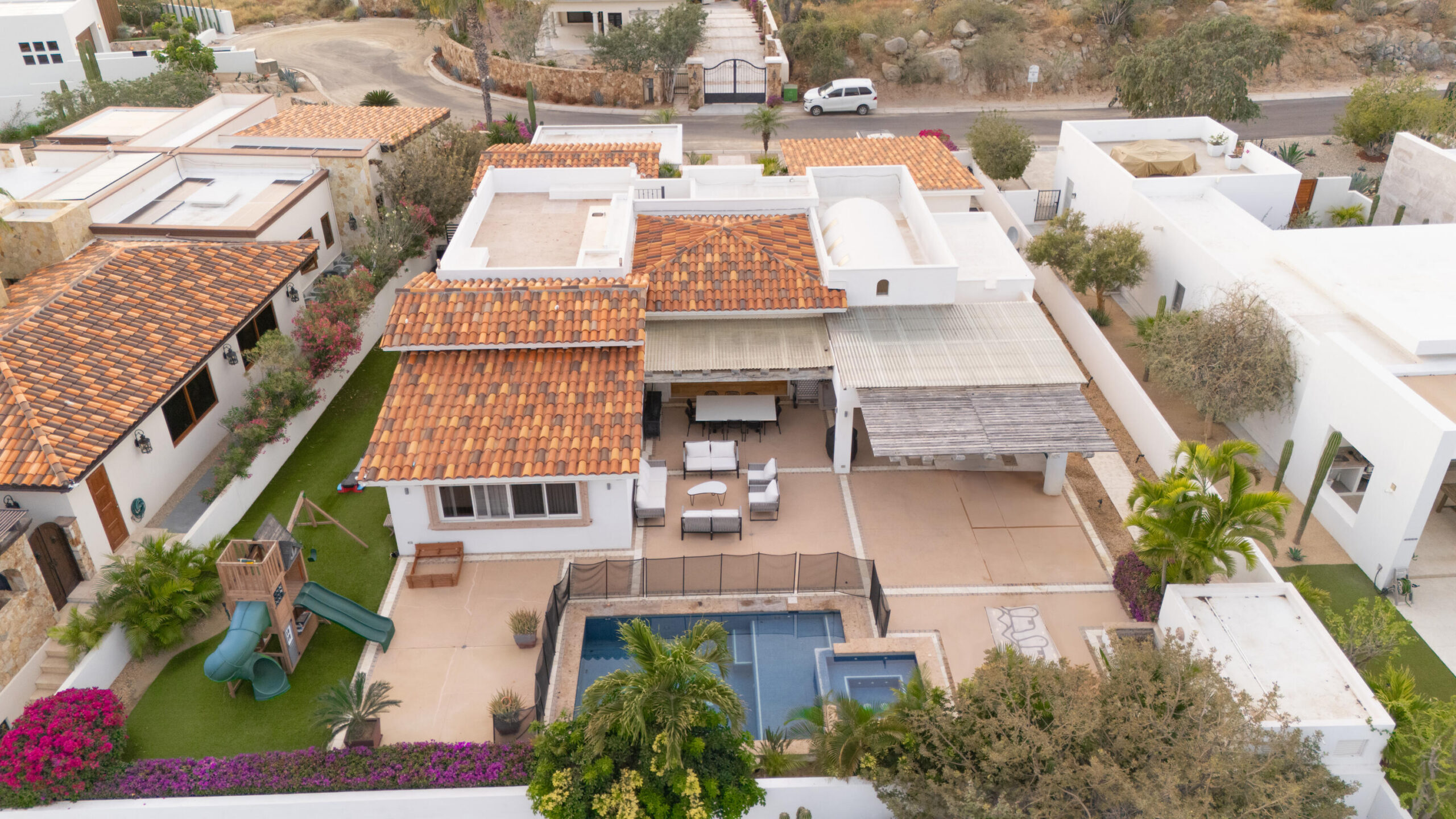 Cabo San Lucas Cresta Del Mar Mediterranean-style Home with a poolside bar and generously proportioned patio with its water features, putting green, pool and spa create a playful inviting atmosphere where friends and family will want to gather. Sunset cocktails atop the rooftop deck with its arch for sale