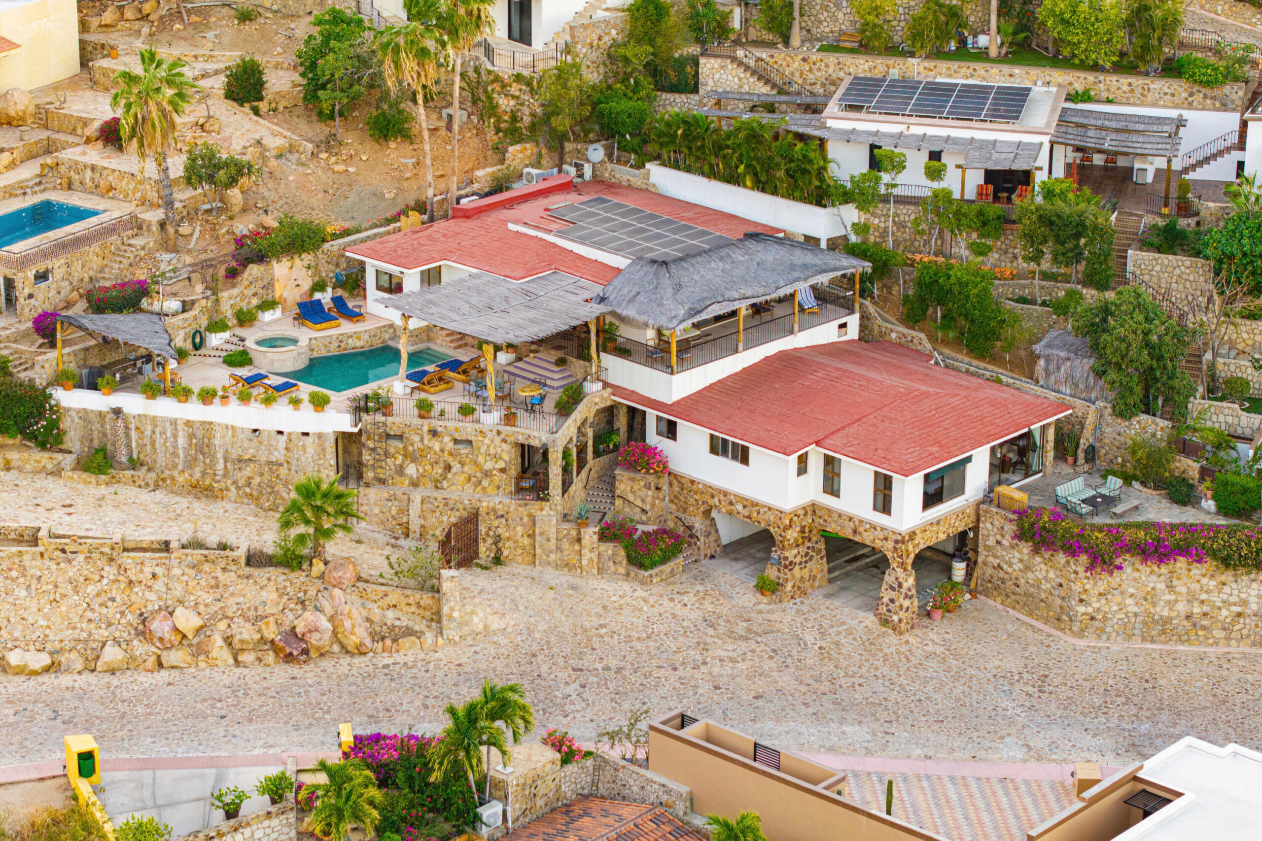 Cabo San Lucas Pedregal Csl Villa Felicidad is a 5-bedroom, 5.5-bath residence in Pedregal that combines scale, location, and proven income potential. Set just minutes from the main gate and within walking distance to the marina, it offers effortless access to Cabo's best dining and nightlife while maintaining privacy. The home features a private pool, expansive terraces, and panoramic marina for sale