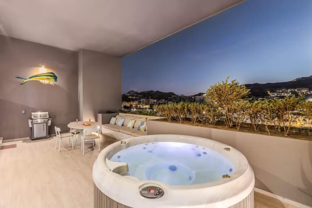 Cabo San Lucas The Paraiso Residences Experience the best location and the luxury with Condo Marina Vista, located at The Paraiso Residences, this modern 2BR/2BA condo is just steps from the world famous Cabo San Lucas Marina, putting you in the heart of the action. Delight yourself with the impressive private terrace, with jacuzzi, grill and much more. With its new and modern taste, Condo Marina Vista is your best option for your second home or investment in Cabo. This condo features modern decor in perfectly lit spaces, fully equipped kitchen with everything you will need, including electric stove, dishwasher, oven, microwave, etc. A spacious and fun living room perfect for entertaining and relaxing, with a comfortable sofa that can make extra sleeping space for one more guest. Two large bedrooms with King size beds and bathroom with shower, both with ample wardrobe space, TV and luxury bedding. The living room is spacious and perfect for entertaining, with a comfortable sofa that can function as an additional sleeping space for one or two more children.Wait until you come out! First open the pocket doors from the living room to the master bedroom to extend your area to the outside terrace with jacuzzi, barbecue and dining for six. Enjoy the huge spacious terrace and its magnificent – Paraiso Residences, Cabo San Lucas, BS