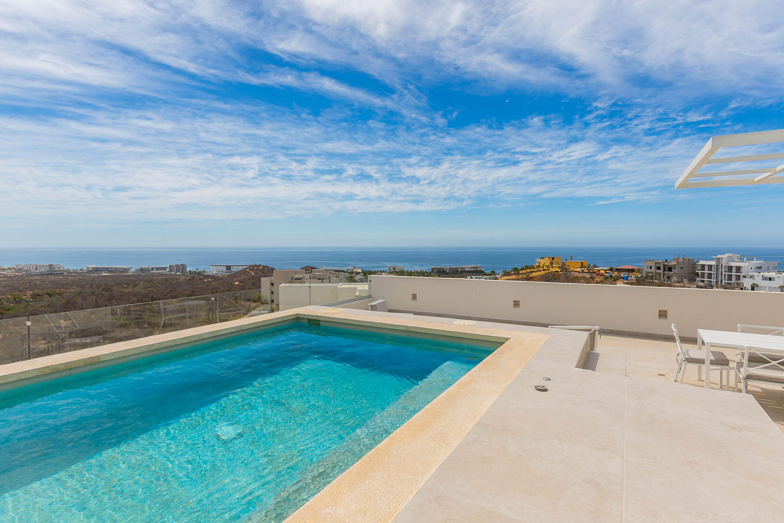Cabo San Lucas El Tule-Inland:General Located in one of El Tule's most relaxing communities, Vistamar Penthouse 2502 is a turnkey design masterpiece. This stunning residence features approximately 1,506 square feet of interior living space complemented by an exceptional 1,184 square feet of rooftop area, creating an expansive and airy atmosphere with breathtaking ocean and desert for sale